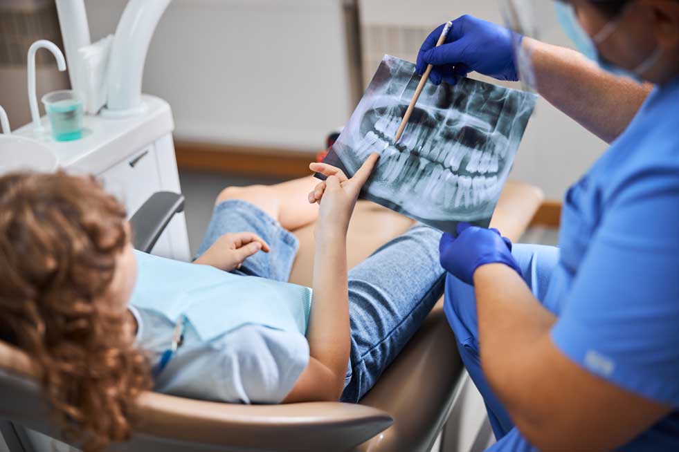 patient checking the dental X-ray