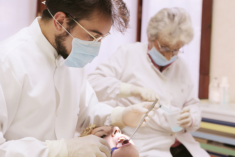 a dentist is treating a patient