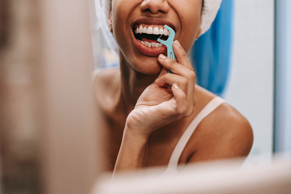 a girl is checking her teeth