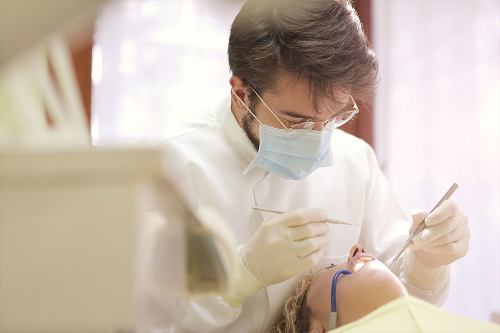 man getting his teeth examined