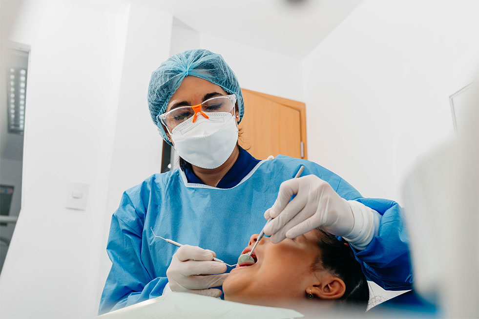 man getting his teeth examined