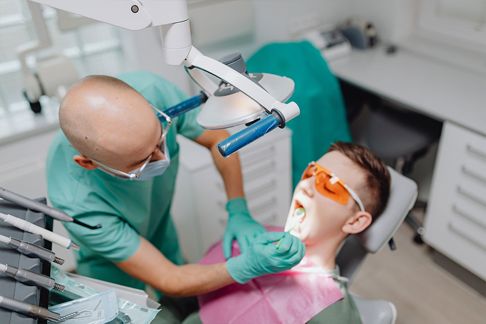 man getting his teeth examined